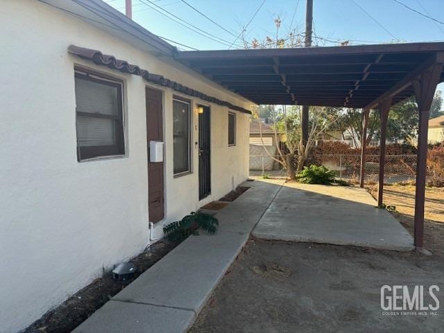 exterior space with a carport