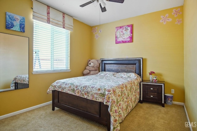 bedroom featuring ceiling fan, carpet floors, and baseboards