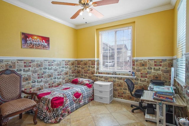 bedroom featuring a ceiling fan, a wainscoted wall, and crown molding