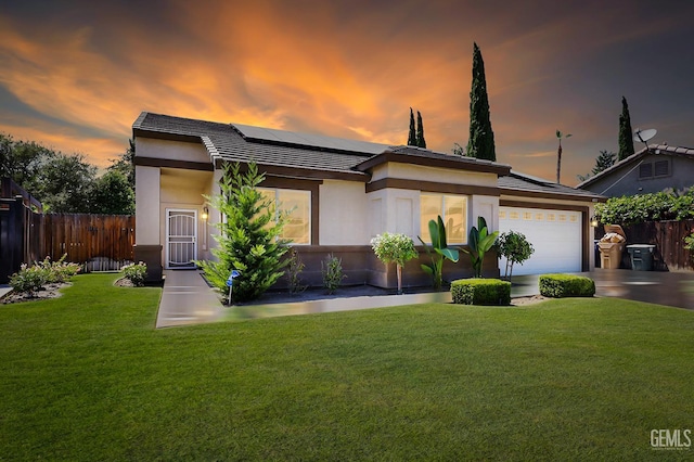 4811 Council Bluffs Ct, Bakersfield, CA 93311 - view of front of property with roof mounted solar panels, a tile roof, a garage, and stucco siding