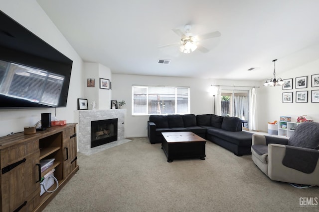 4811 Council Bluffs Ct, Bakersfield, CA 93311 - living area featuring light colored carpet, a ceiling fan, a fireplace with flush hearth, and a chandelier