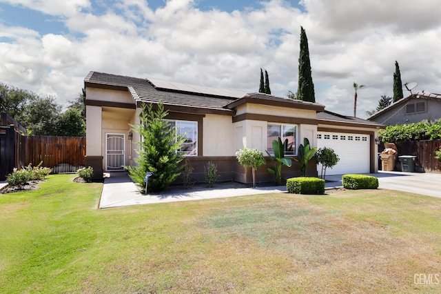 4811 Council Bluffs Ct, Bakersfield, CA 93311 - view of front facade with a tiled roof, roof mounted solar panels, an attached garage, driveway, and stucco siding