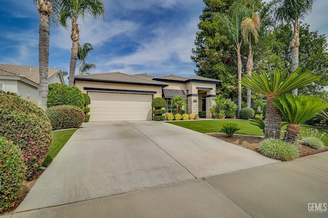 502 Lewisham St, Bakersfield, CA 93311 - view of front of property with stucco siding, concrete driveway, a garage, and a front yard