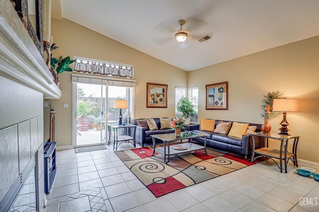 502 Lewisham St, Bakersfield, CA 93311 - living room with a ceiling fan, vaulted ceiling, tile patterned floors, and baseboards