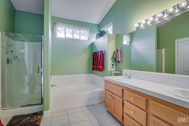 502 Lewisham St, Bakersfield, CA 93311 - bathroom with a garden tub, a stall shower, double vanity, vaulted ceiling, and tile patterned floors
