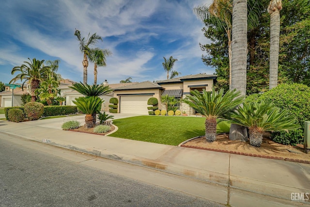 502 Lewisham St, Bakersfield, CA 93311 - view of front of home with concrete driveway, a garage, stucco siding, and a front lawn