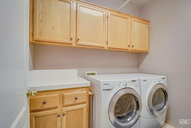 502 Lewisham St, Bakersfield, CA 93311 - laundry area featuring cabinet space and independent washer and dryer