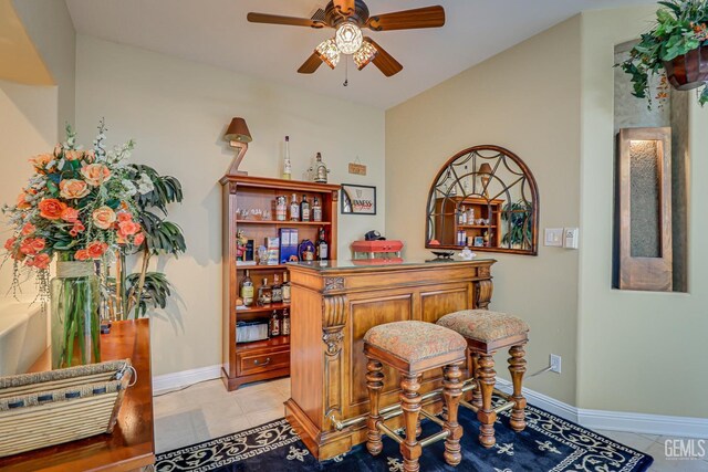 502 Lewisham St, Bakersfield, CA 93311 - indoor dry bar featuring light tile patterned flooring, ceiling fan, and baseboards