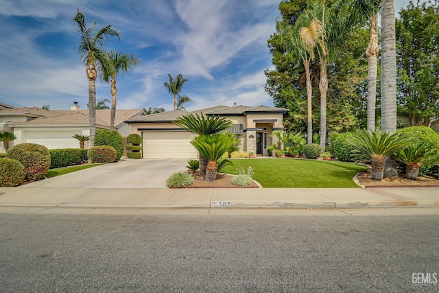 502 Lewisham St, Bakersfield, CA 93311 - view of front of property with driveway, stucco siding, a garage, and a front yard