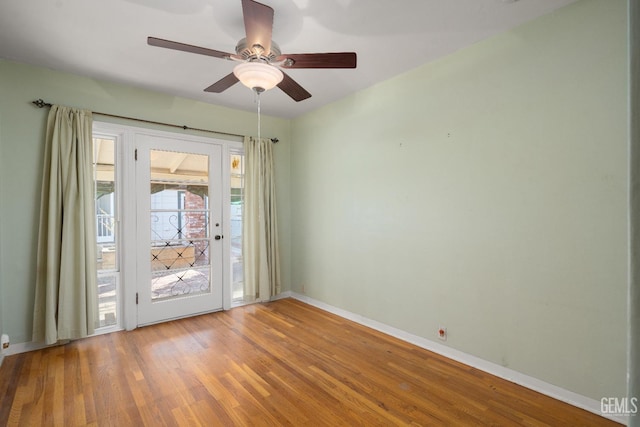 entryway featuring wood-type flooring and ceiling fan