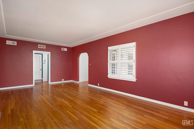 unfurnished room featuring hardwood / wood-style floors