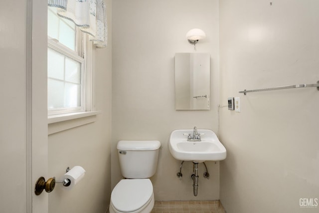 bathroom with sink and toilet