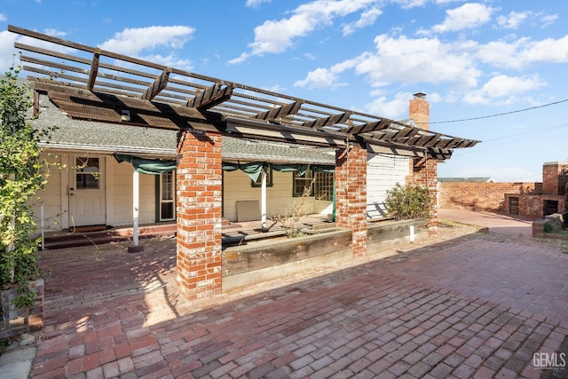 view of patio featuring a pergola