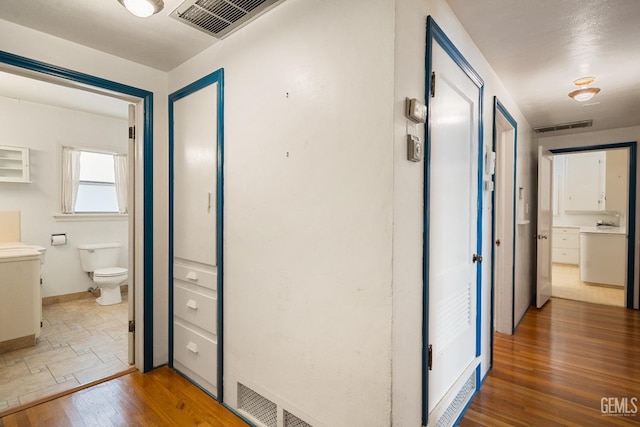 corridor featuring dark wood-type flooring