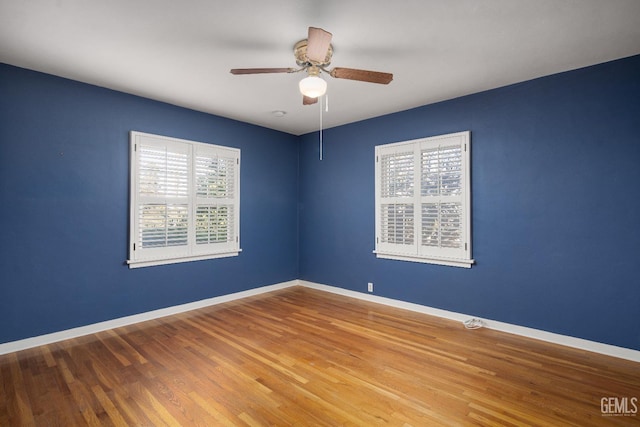 unfurnished room featuring hardwood / wood-style flooring and ceiling fan