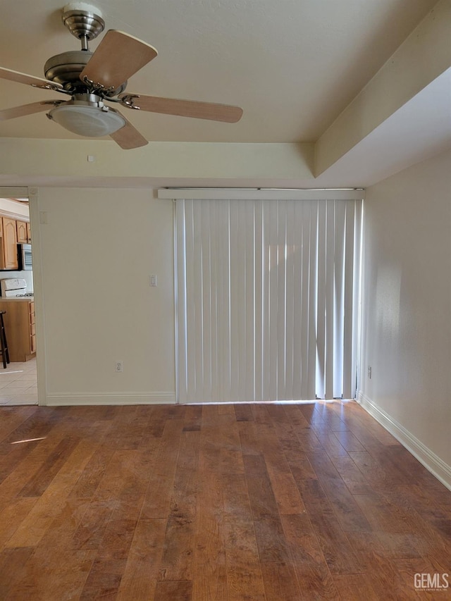 empty room featuring ceiling fan and wood-type flooring