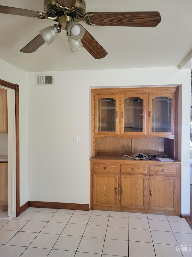 kitchen featuring ceiling fan and light tile patterned flooring