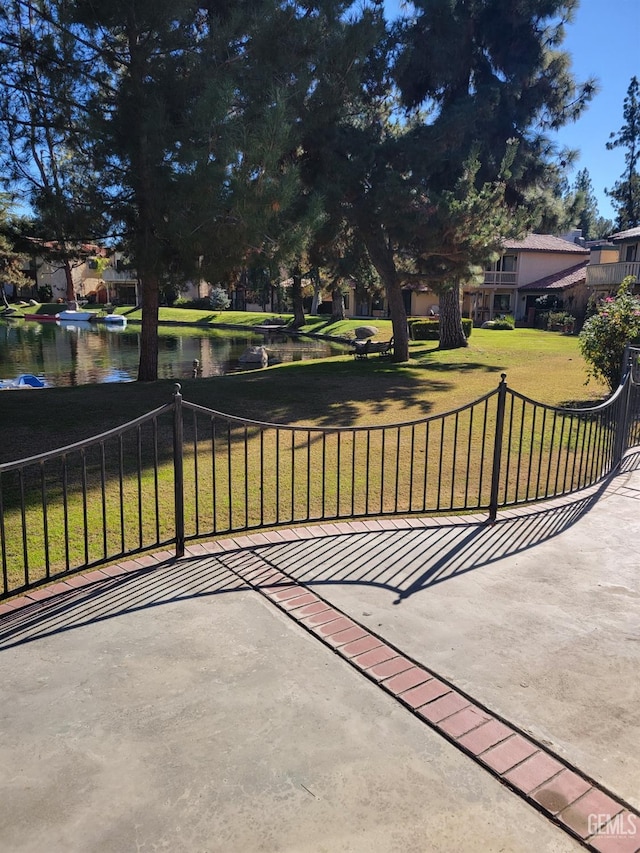 view of patio with a water view