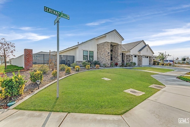 view of front facade with a garage and a front yard