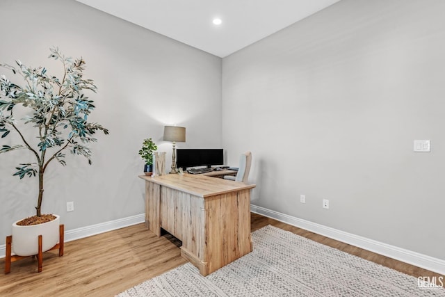 office space with light hardwood / wood-style floors