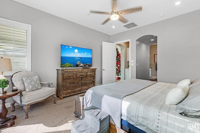 bedroom featuring ceiling fan and light carpet