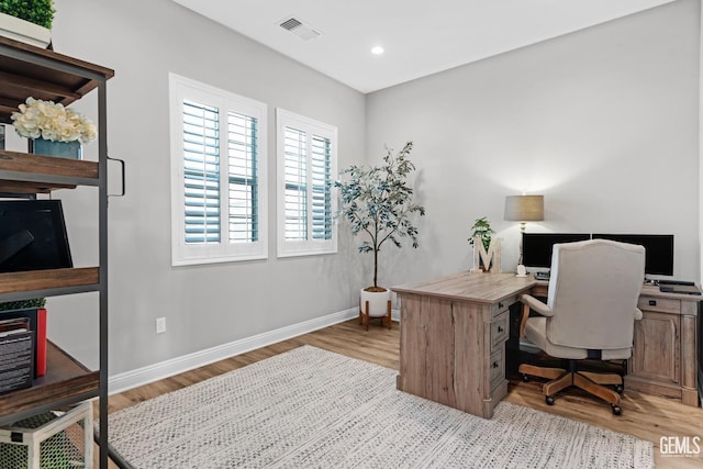 office space with light wood-type flooring