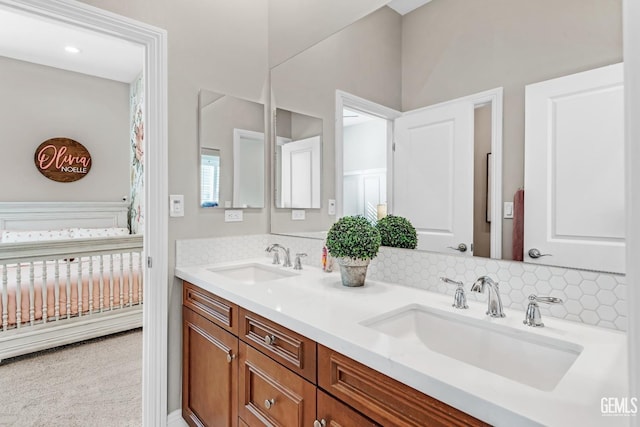 bathroom with decorative backsplash and vanity