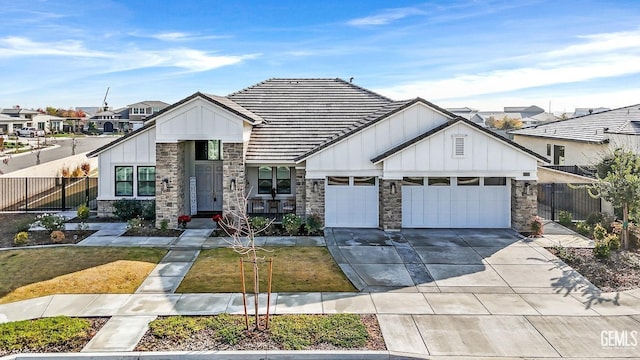 view of front of property with a front yard and a garage