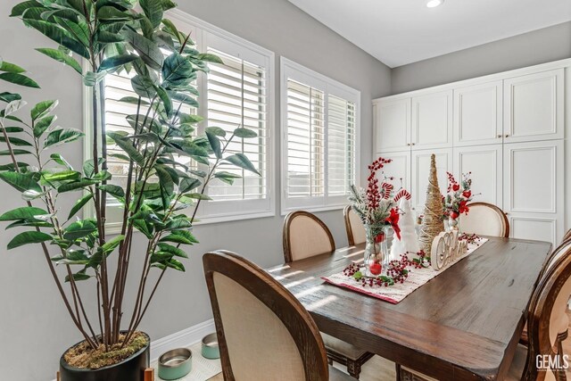 kitchen with white cabinets, sink, and backsplash