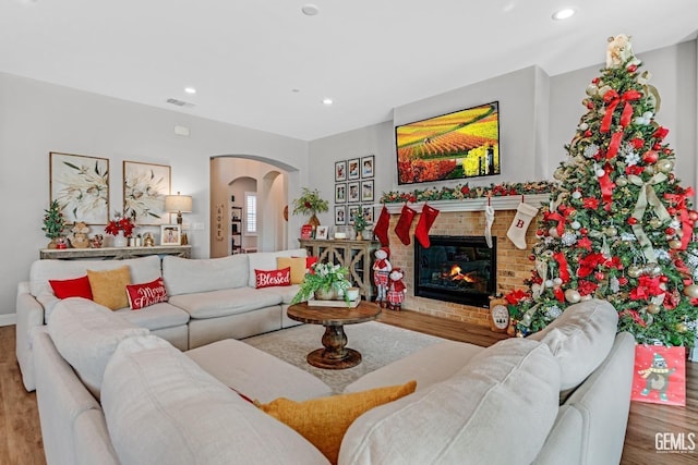 living room featuring a fireplace and hardwood / wood-style floors