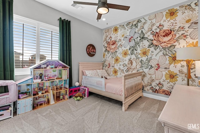 bedroom featuring ceiling fan and light carpet