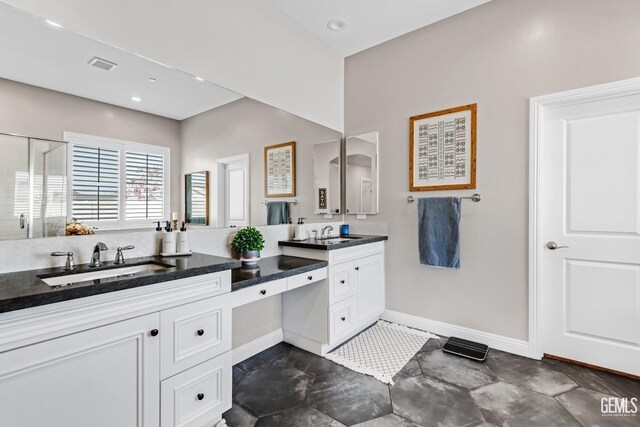 bathroom featuring vanity and walk in shower