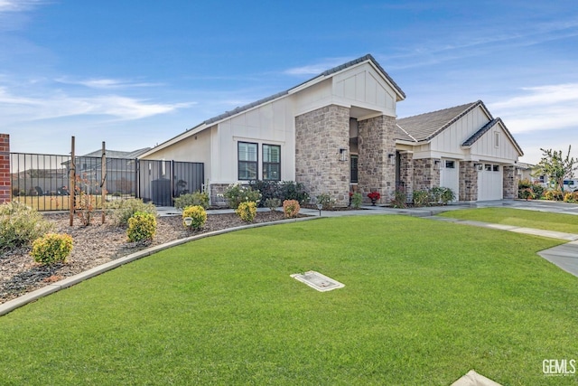 view of front of home with a front lawn and a garage