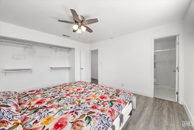 21633 Golden Hills Blvd, Tehachapi, CA 93561 - bedroom with wood finished floors, a ceiling fan, a closet, and ensuite bathroom