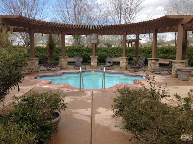 view of swimming pool with a pergola and a patio