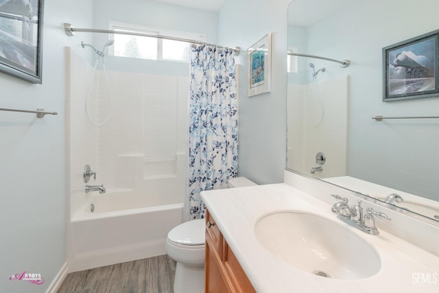 full bathroom featuring shower / bathtub combination with curtain, hardwood / wood-style floors, vanity, and toilet