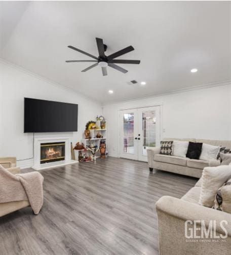 337 Cesar Chavez Ln, Delano, CA 93215 - living area with vaulted ceiling, french doors, ceiling fan, recessed lighting, and wood finished floors