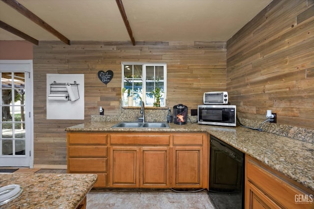 kitchen with beam ceiling, stainless steel microwave, brown cabinetry, a sink, and dishwasher