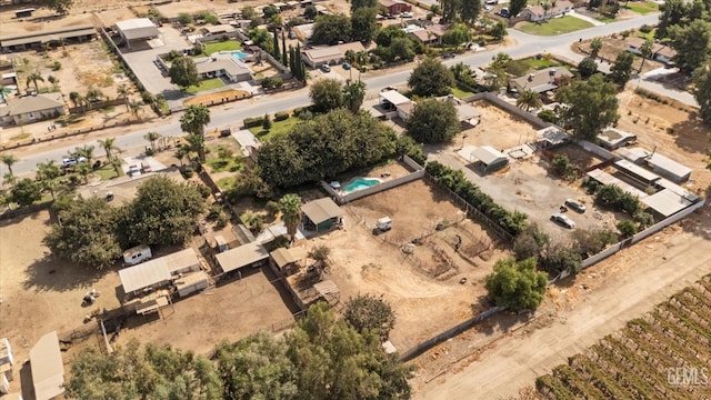 drone / aerial view with a residential view and view of desert