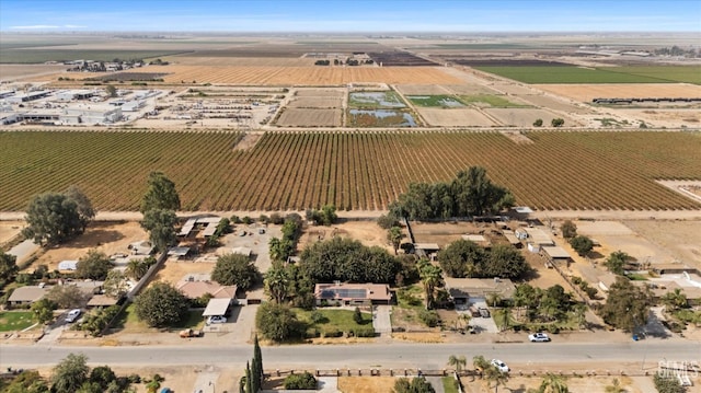 birds eye view of property with a rural view