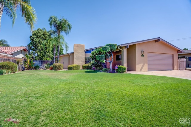 view of front facade with a front yard and a garage