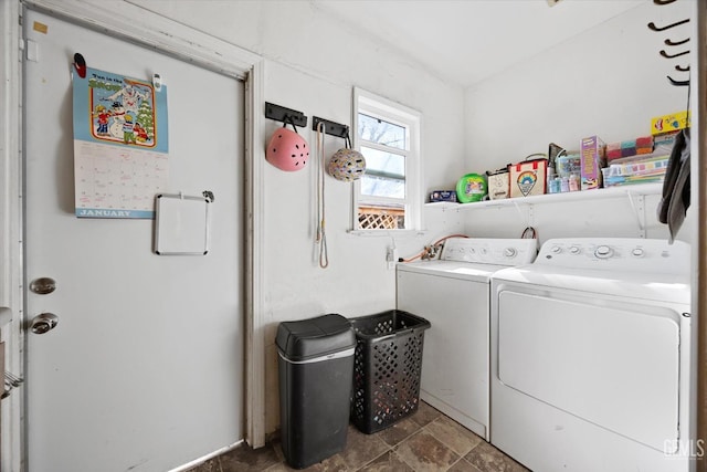 washroom with washer and dryer