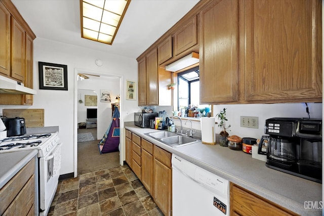 kitchen featuring white appliances, ceiling fan, and sink