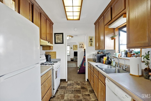 kitchen featuring white appliances, ceiling fan, and sink