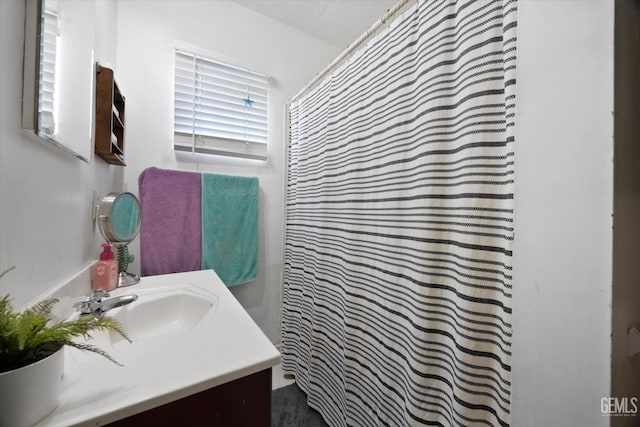 bathroom featuring vanity and a shower with curtain