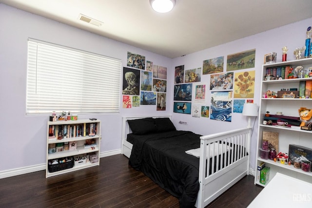 bedroom featuring dark hardwood / wood-style floors