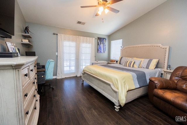 bedroom featuring ceiling fan, dark wood-type flooring, and lofted ceiling