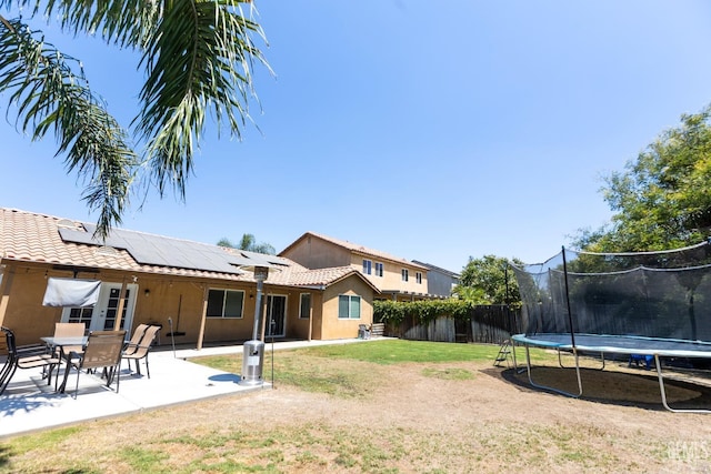 view of yard with a patio area and a trampoline