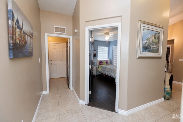 hallway with light tile patterned floors