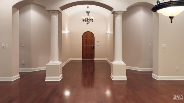 3006 Springbank Ct, Bakersfield, CA 93311 - entrance foyer with ornate columns, dark wood-style flooring, baseboards, and arched walkways